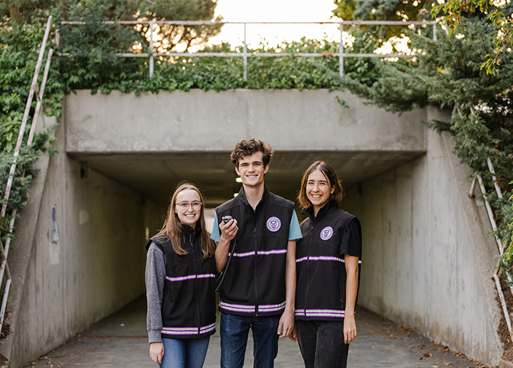 3 people wearing Western University's Foot Patrol vest